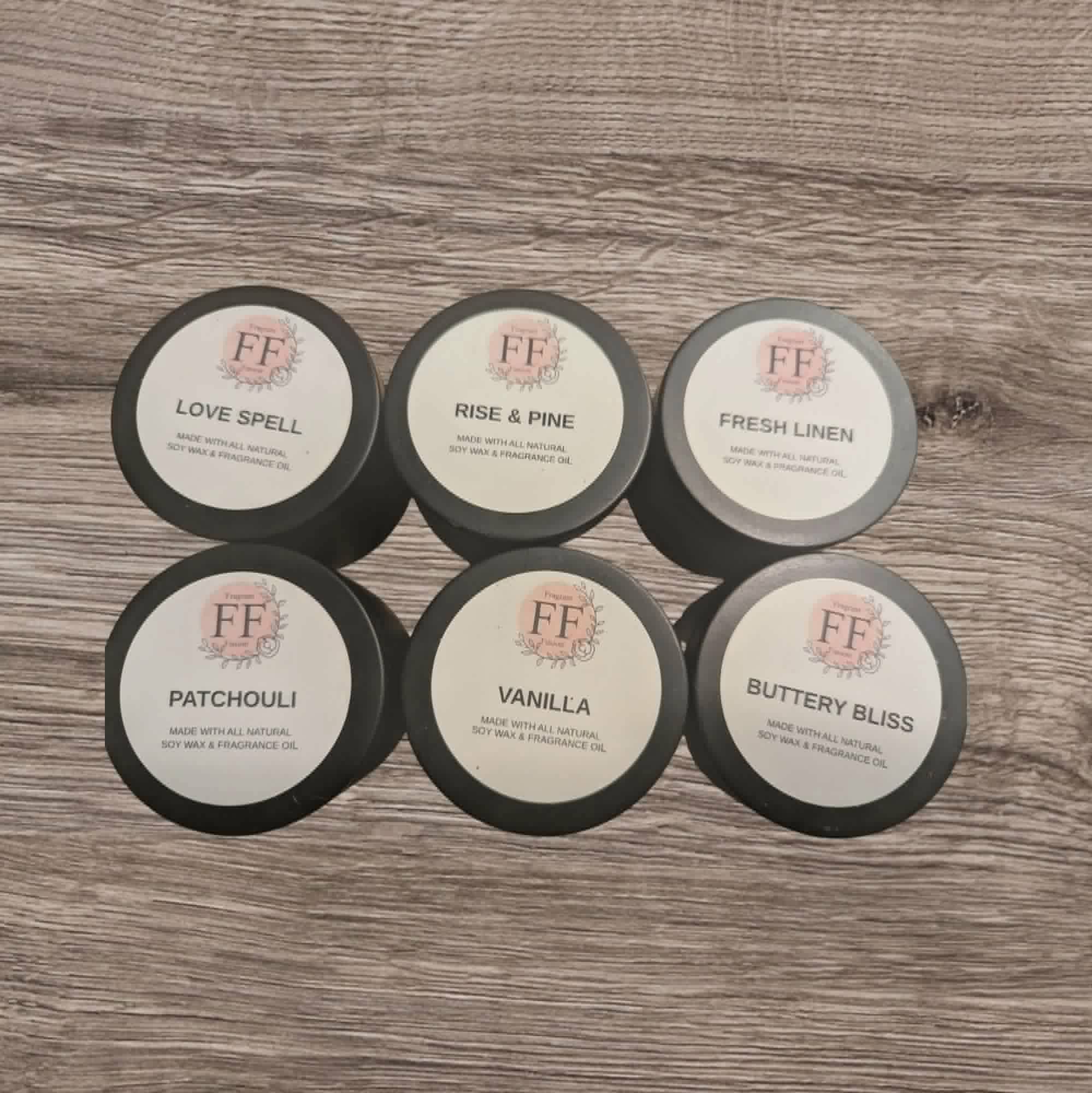 Set of FF branded wax melts on a wooden surface