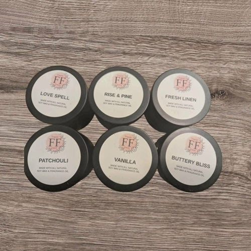 Set of FF branded wax melts on a wooden surface