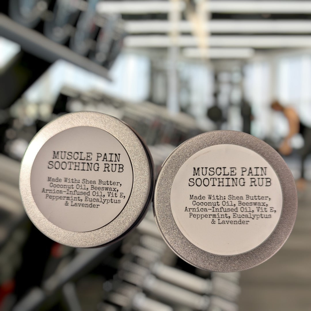 Two containers of Muscle Pain Soothing Rub with a gym background