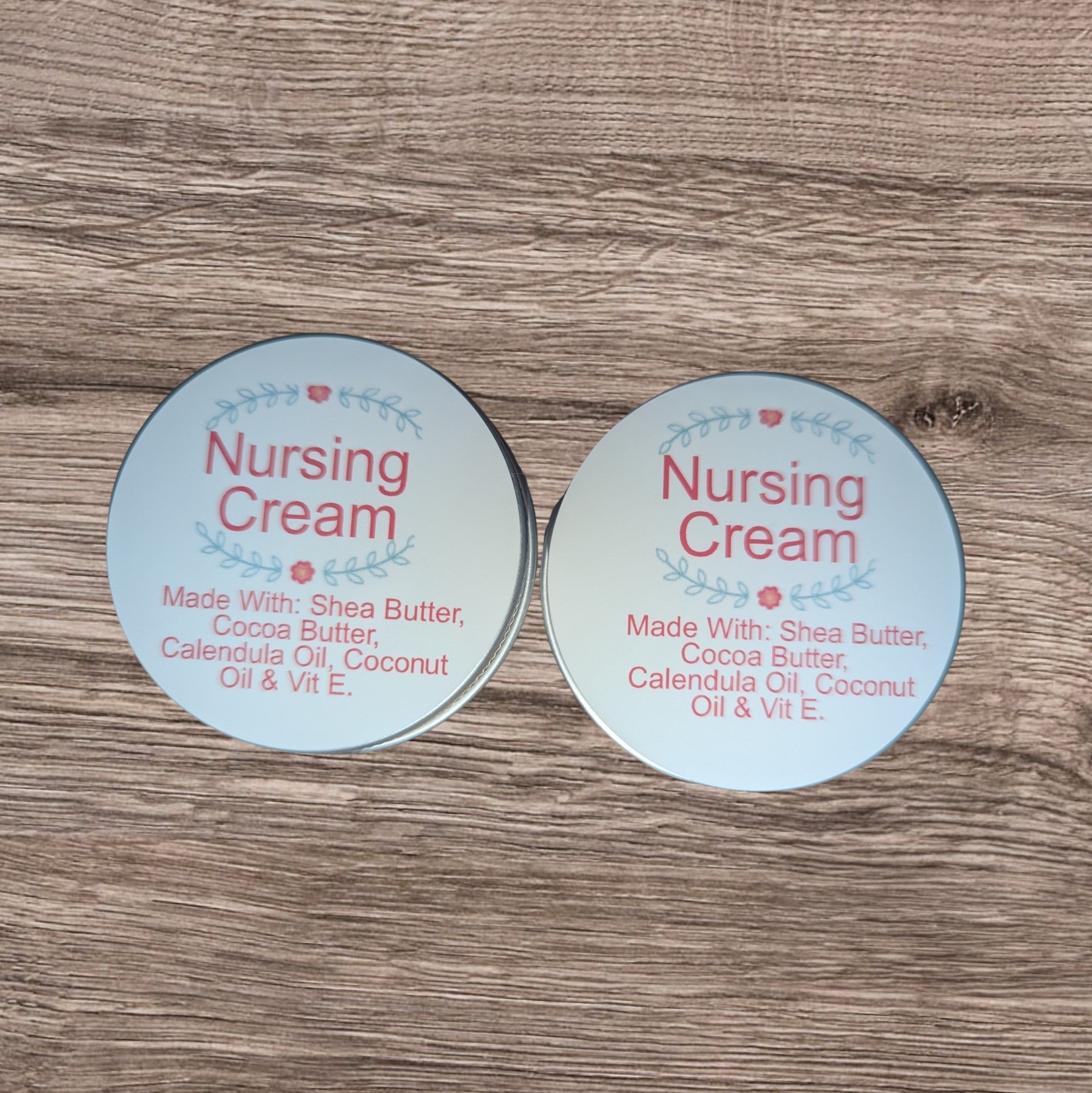 Two containers of Nursing Cream on a wooden surface